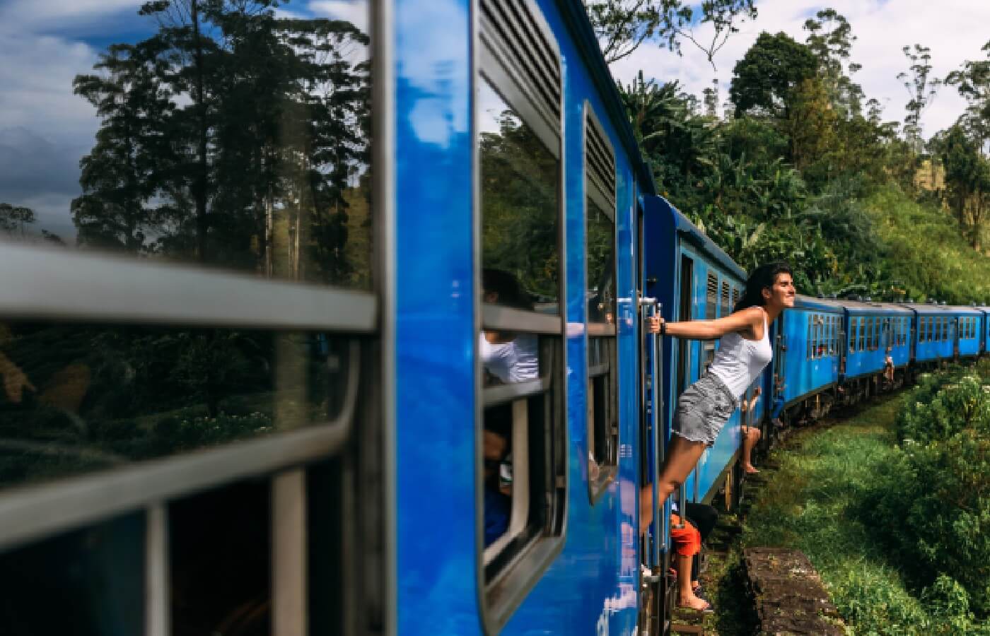 A tourist traveling on a sri lankan train